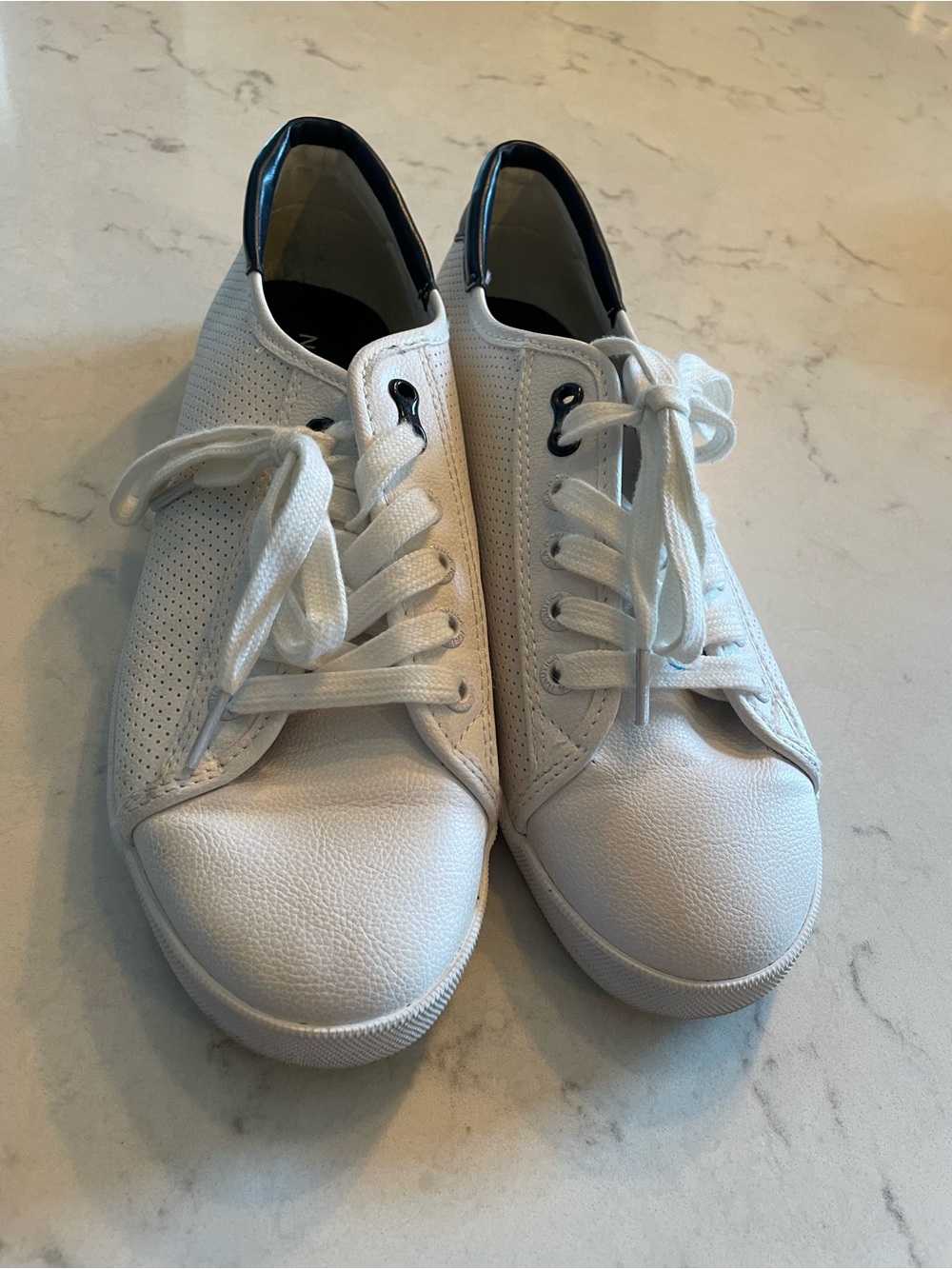 White Perforated Leather Sneakers with Navy Heel Accent. Item# 11652